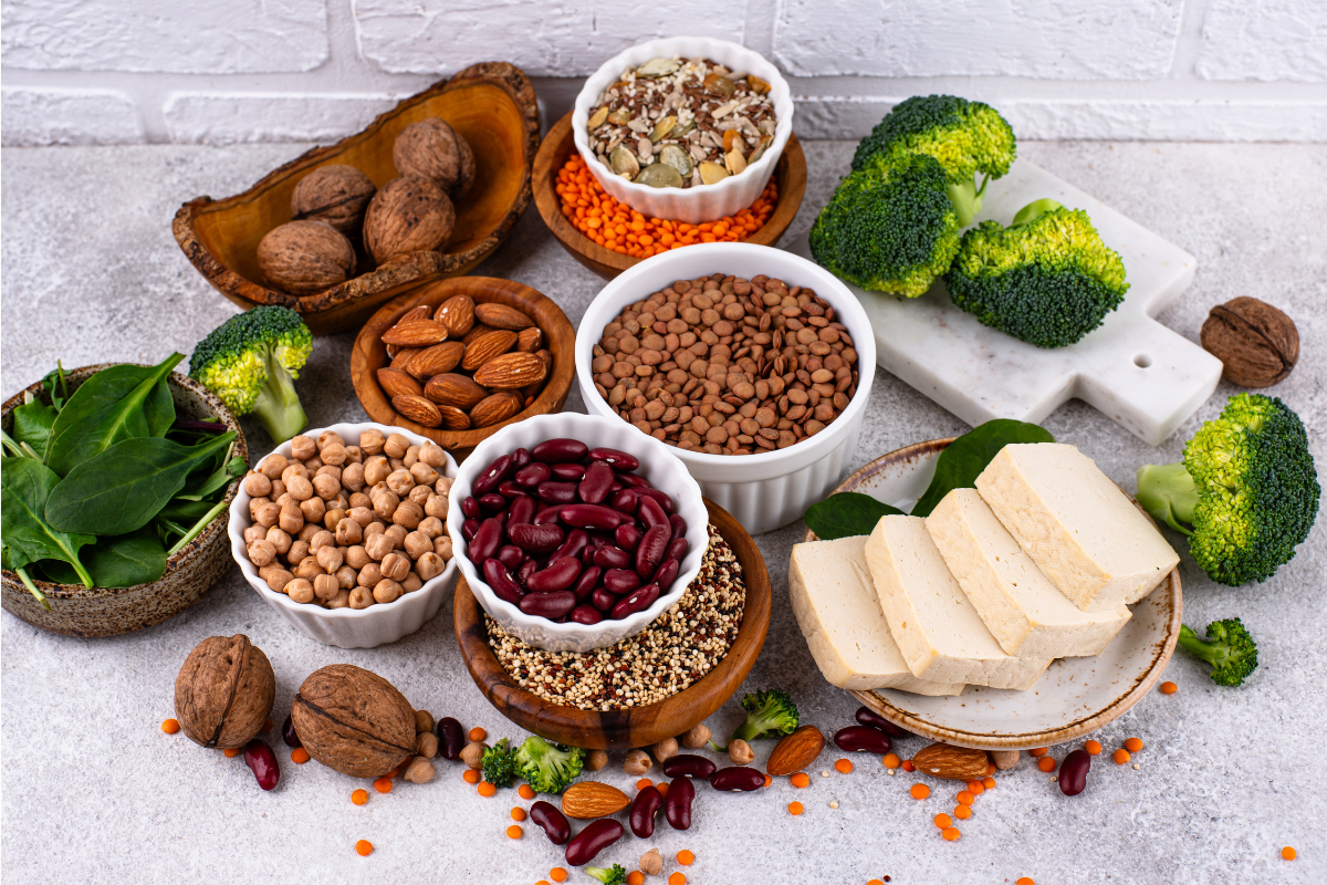 Plant-based diet foods including vegetables, fruits, legumes, and grains