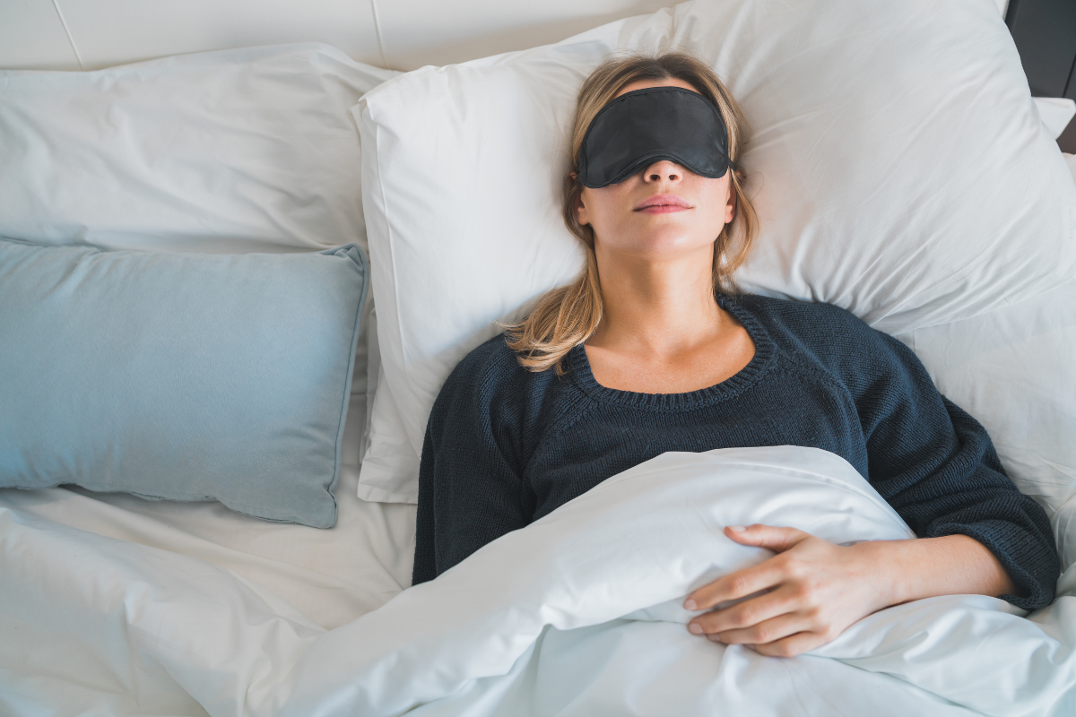 Person sleeping peacefully with visual indicators of metabolic processes and hormone regulation