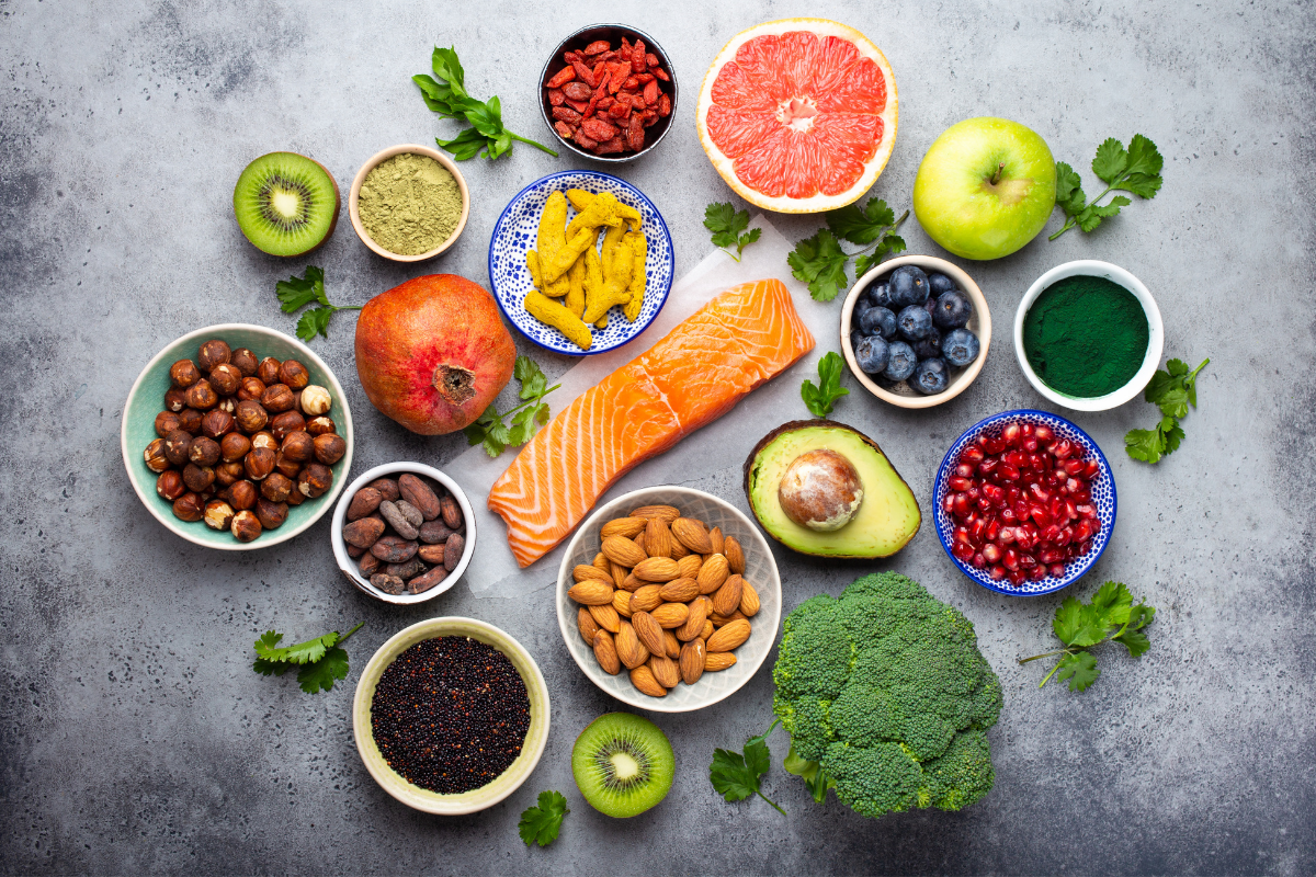 Various superfoods including berries, seeds, and leafy greens